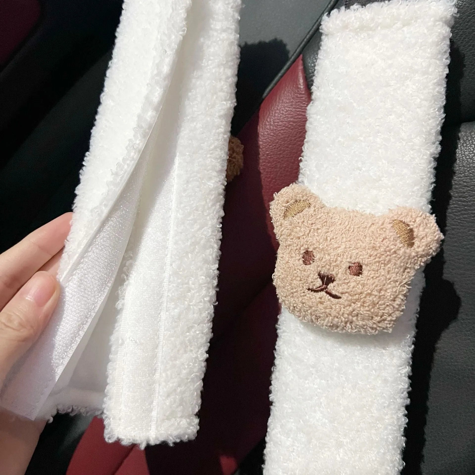 Cartoon bear design plush car seat belt protective cover for infant safety, showing khaki and coffee colour options