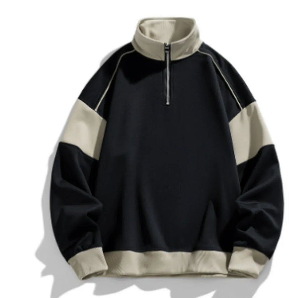 A man's grey hooded corduroy sweater with drop shoulders and loose lapels laid flat.
