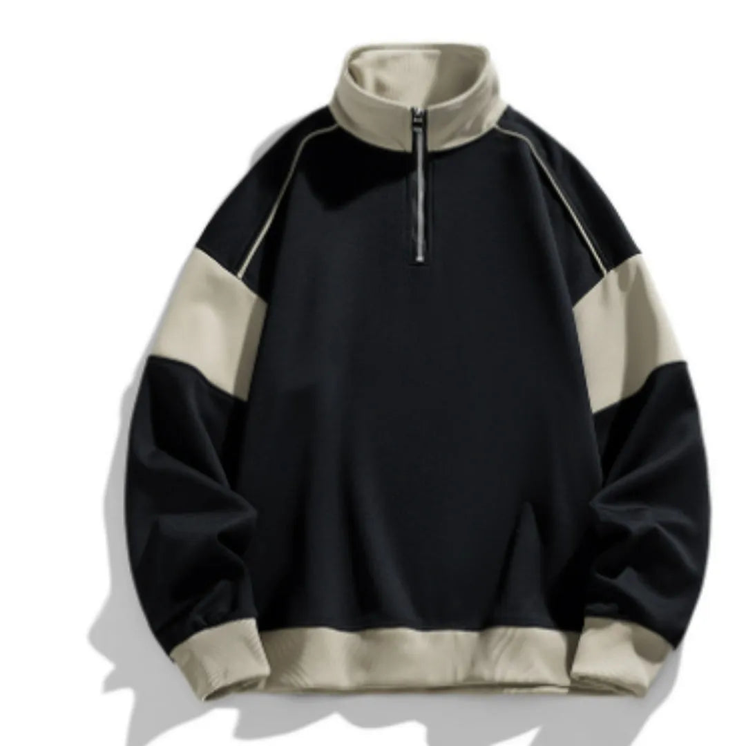 A man's grey hooded corduroy sweater with drop shoulders and loose lapels laid flat.