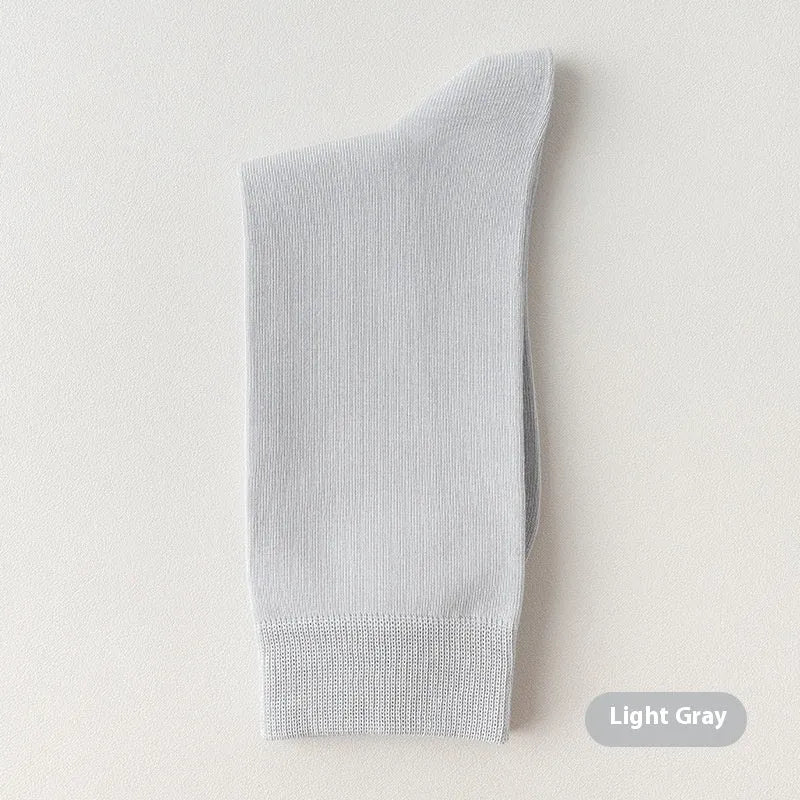 Mid-calf business men's socks in pure combed cotton with sweat absorption and deodorant properties, solid colour design