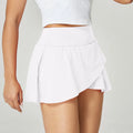 Women's solid colour quick-drying nylon sports shorts with spandex lining for summer fitness.