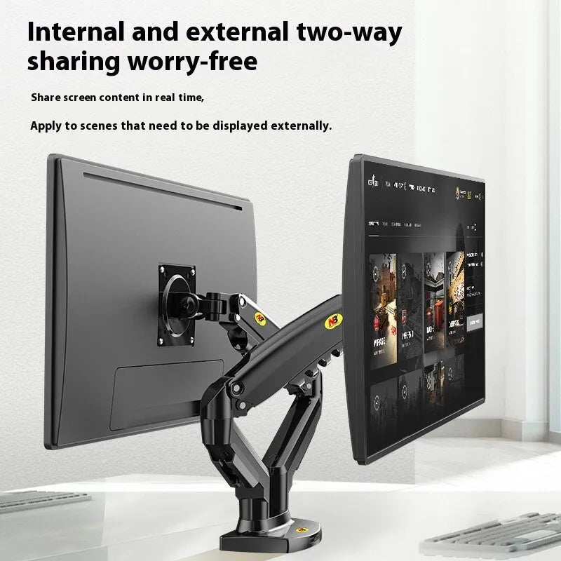 Black dual monitor desktop lifting rack holding two computer displays with mechanical height adjustment mechanism