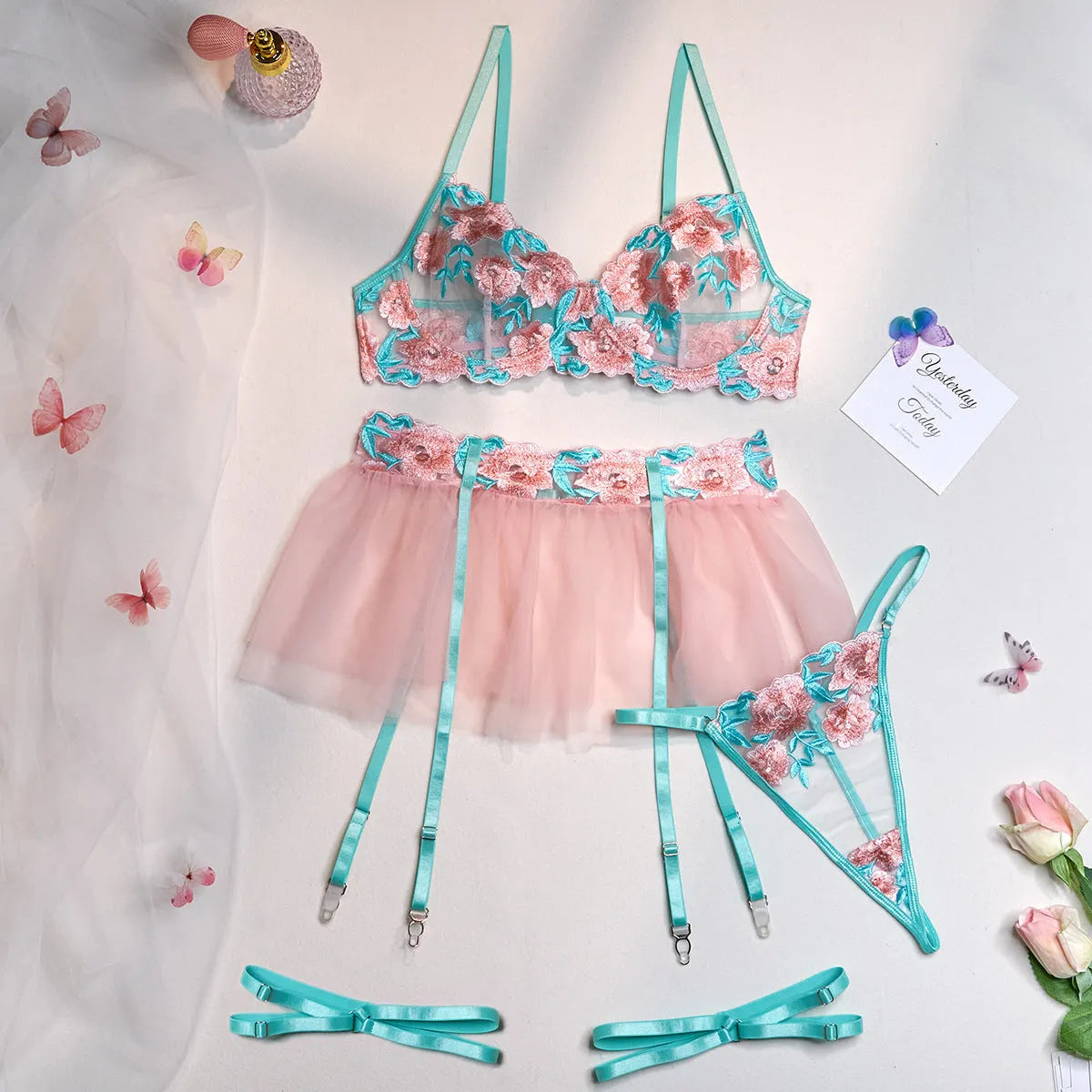Pink women's mesh pettiskirt two-piece suit with matching embroidered bikini top.
