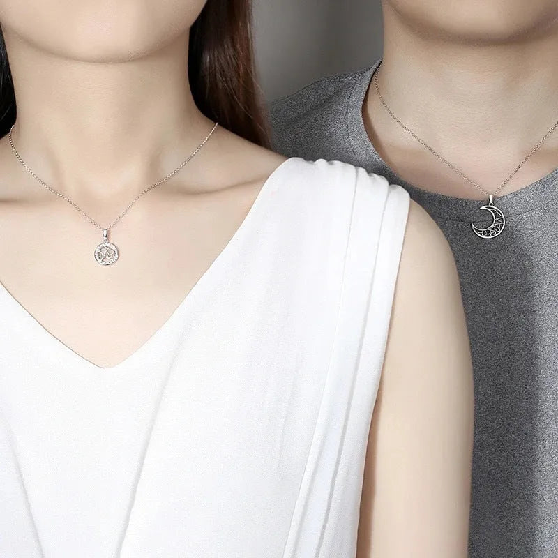 Sun Moon Tooth Couple Necklace with copper electroplated pendants showing sun and moon symbols on cross chain