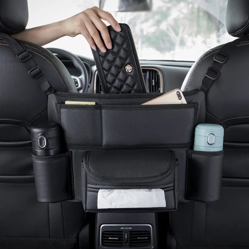 Black leather car seat hanging organiser with tissue box between vehicle seats