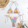 Women's multicolour floral triangle bikini with smocking detail on the top and briefs bottom.
