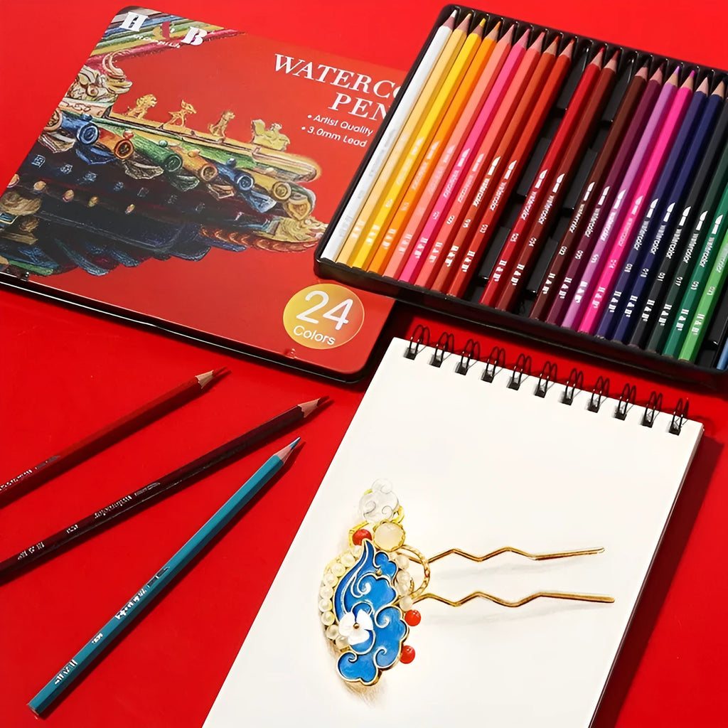 Metal tin box open to show 24 water-soluble coloured pencils in wooden casings.