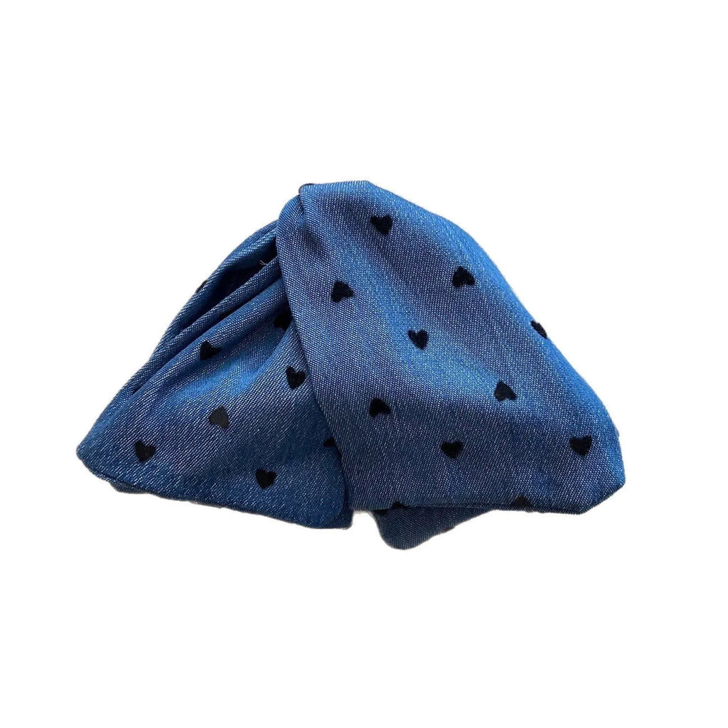 Handmade women's plastic hairpin with denim bow and triangular grip.