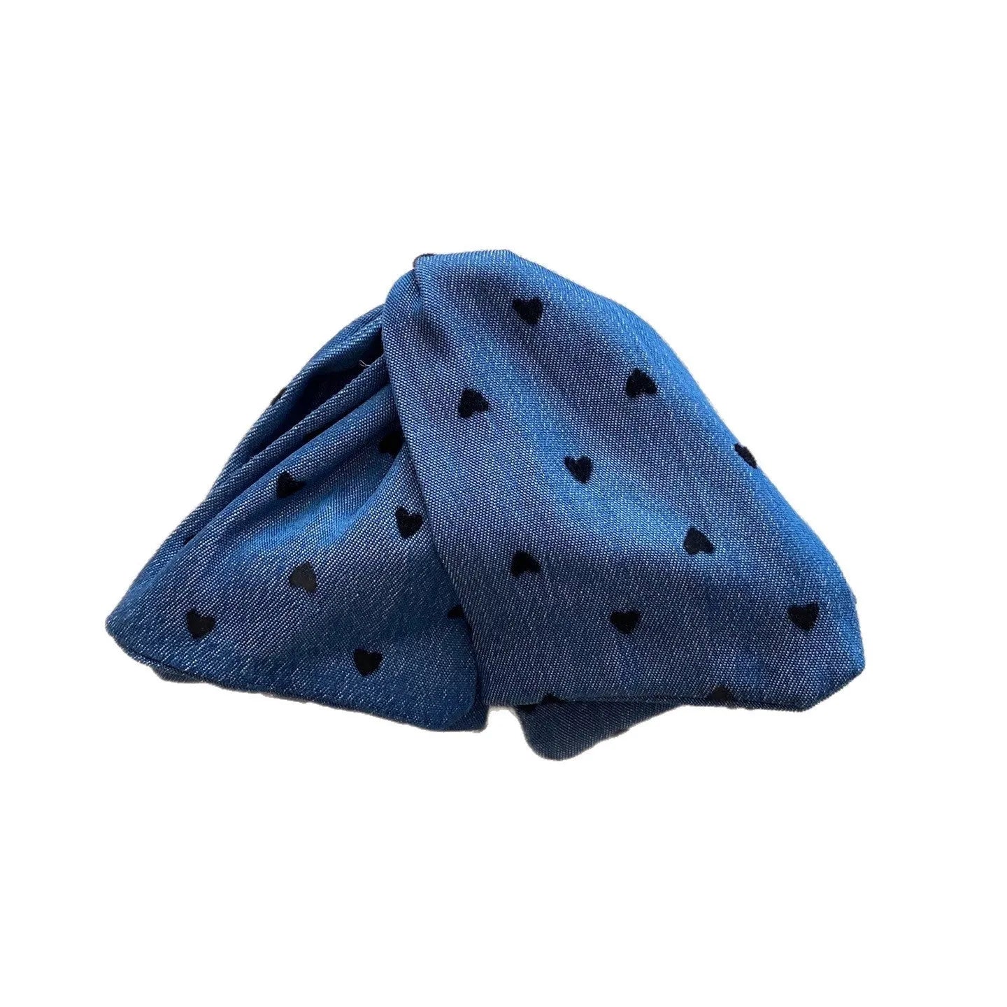 Handmade women's plastic hairpin with denim bow and triangular grip.