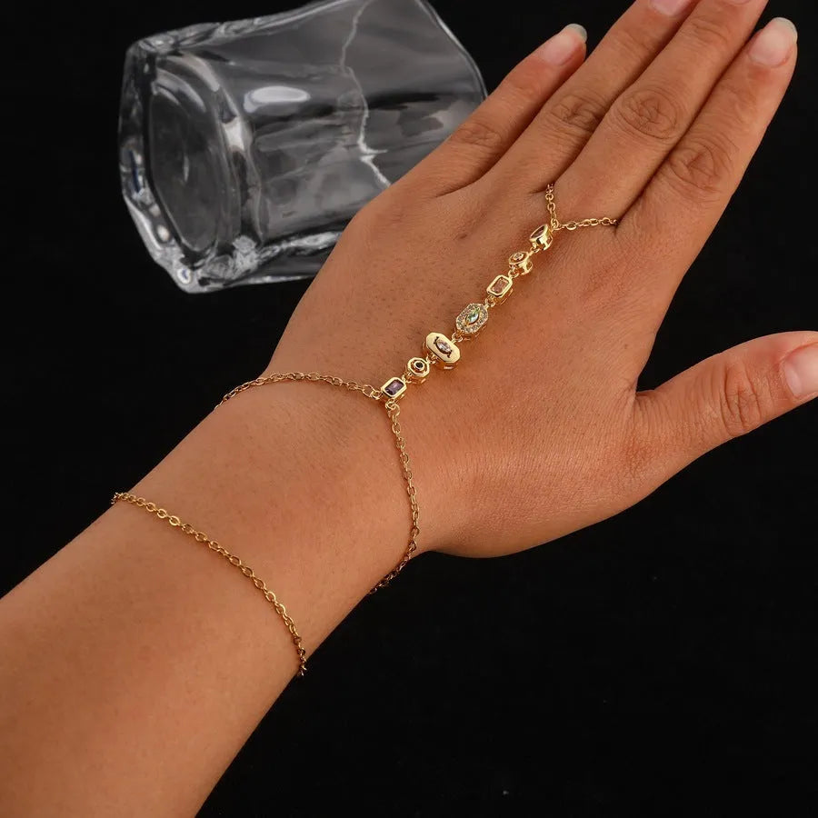 Titanium steel tassel rhinestone finger chain bracelet in drop shape, gold or silver colour options