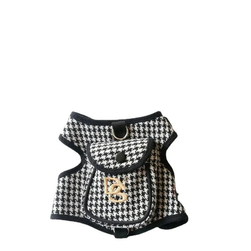 Black houndstooth cotton vest for a small dog, showing the leash attachment strap on the back.