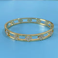Gold and silver hollow women's bracelets with four-leaf clover charms and inlaid zircon detailing.