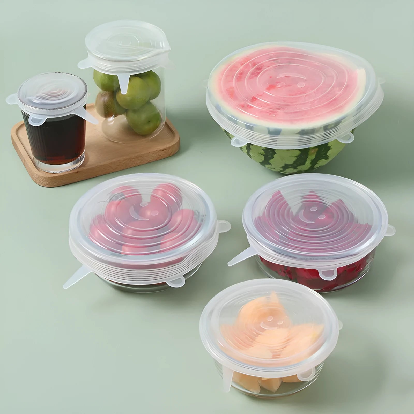Set of six colourful silicone stretch lids in different sizes for covering food containers.