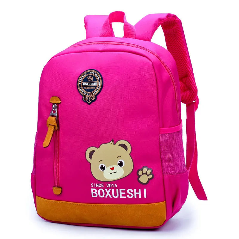 Cartoon bear schoolbag for nursery school children in deep blue and mei red colour options.
