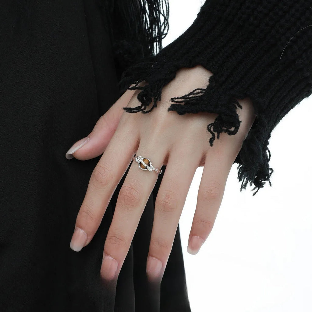 Women's adjustable Saturn open ring in electroplated white gold colour showing original design and adjustable opening mechanism