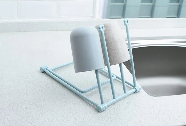 Foldable plastic dishcloth shelf in light blue with vertical towel storage