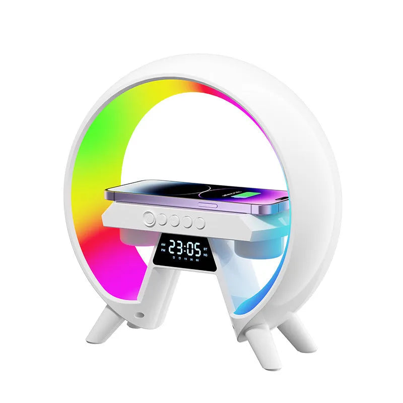 Black Bluetooth bedside speaker with wireless charging pad and LED clock display on white surface