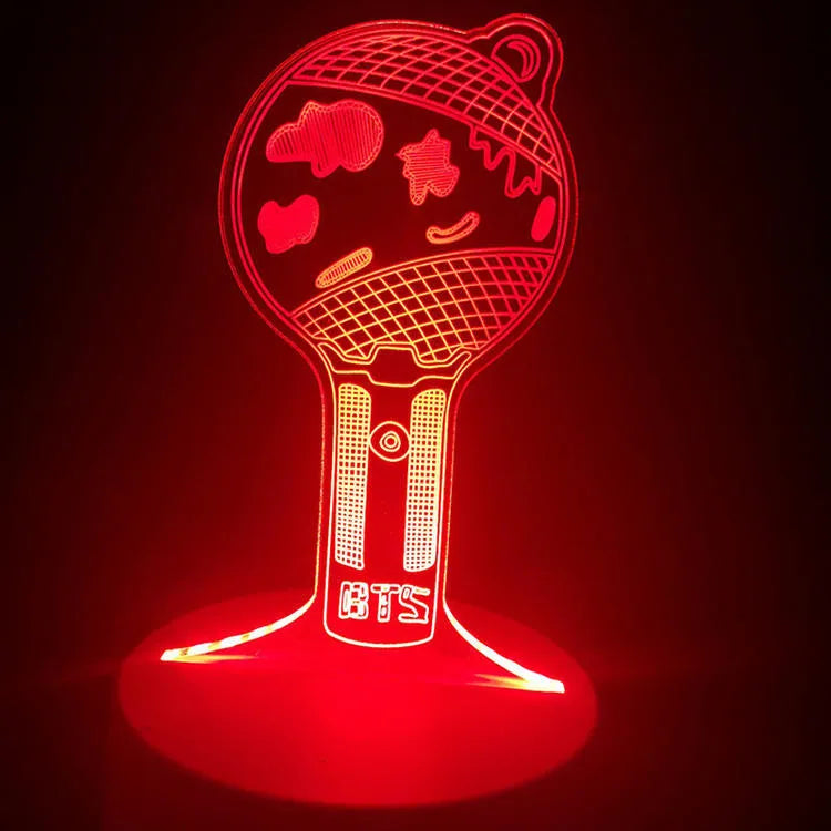 BTS-themed acrylic light-up display stand holding BTS Light 101 Tower Gem collectible
