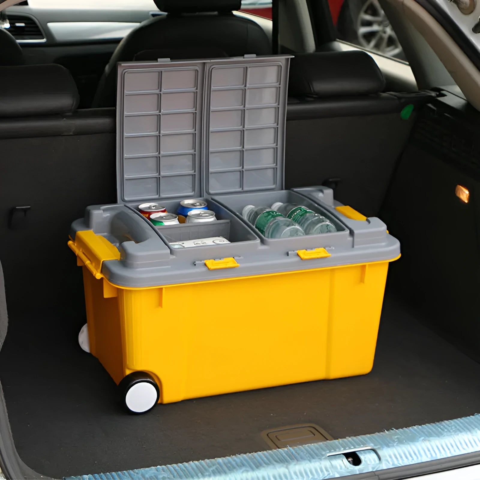 Large orange plastic storage box with pull-out handle and wheels, showing 55L capacity and double-seal lid.