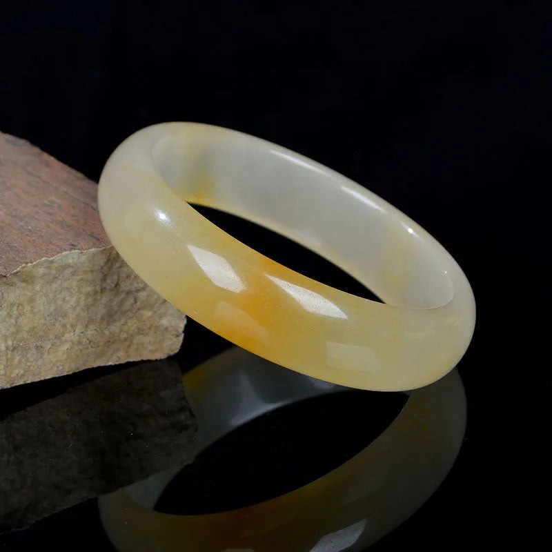 Natural light jade bracelet for women in Chinese style with polished finish on wrist