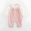 Pink embroidered cotton jumpsuit for baby girl with long sleeves and single-breasted closure