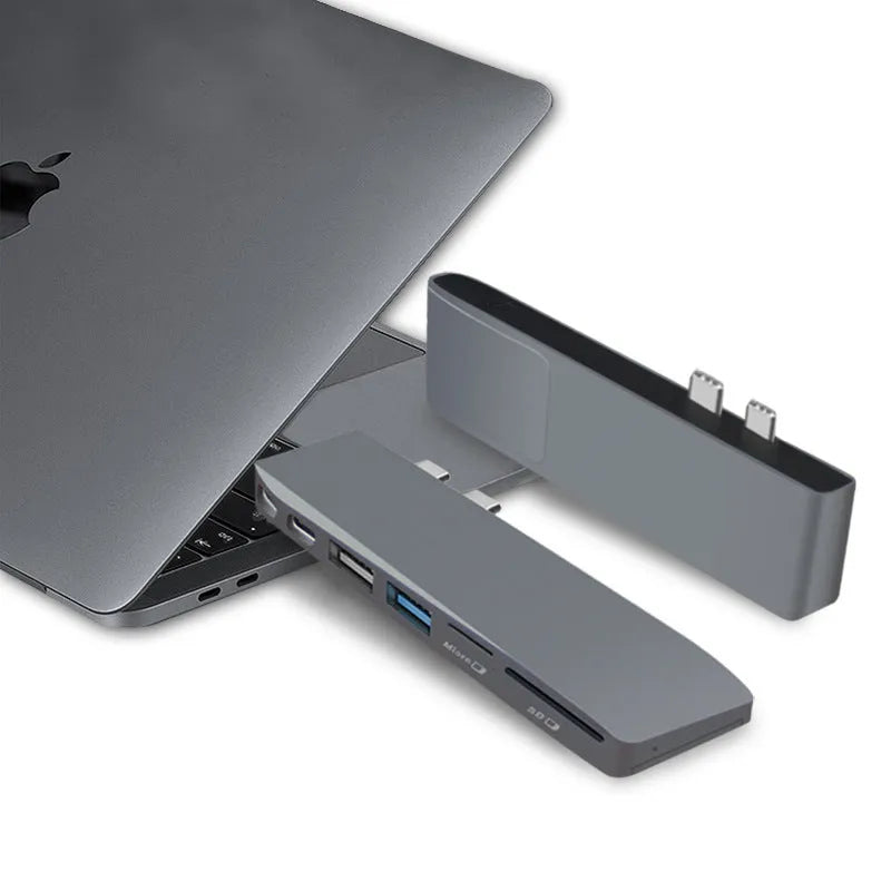 An 8-in-1 USB-C hub with dual plugs for MacBook Pro, showing USB, HDMI, and card reader ports.