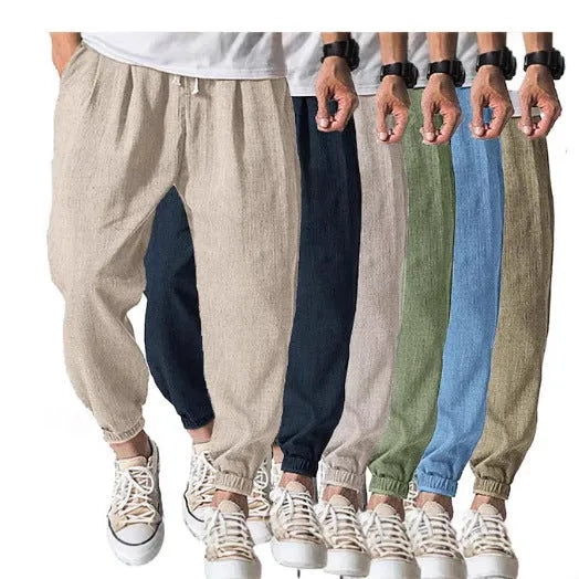 Man wearing loose light-coloured cotton trousers with a banded ankle cuff