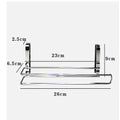 Silver stainless steel cabinet door back hanging paper towel rack on a kitchen cabinet.