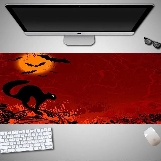Oversized Halloween-themed mouse pad on desk with non-slip rubber cloth base and large surface area