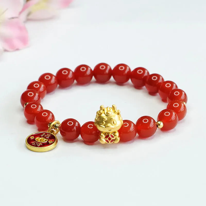 Close-up of a red agate bead dragon zodiac bracelet on a wrist, showing 8mm beads and Chinese style design.