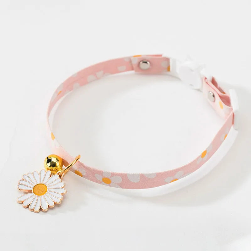 Adjustable cat collar with bell pendant and bow tie on small dog showing 17-33cm sizing range