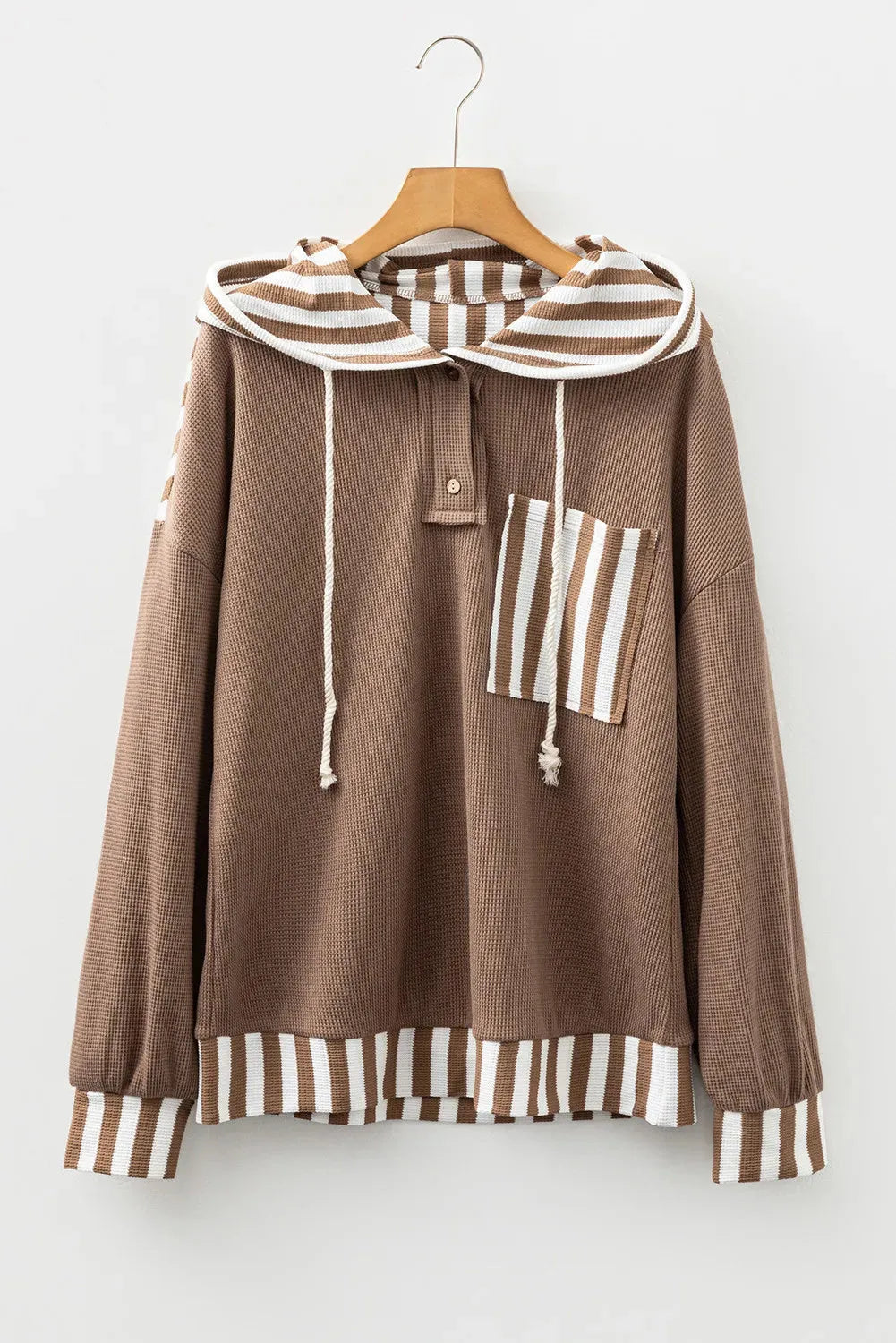 Straw yellow hoodie with waffle texture, striped patchwork design, button neck, and drawstring hood in sizes S M L XL
