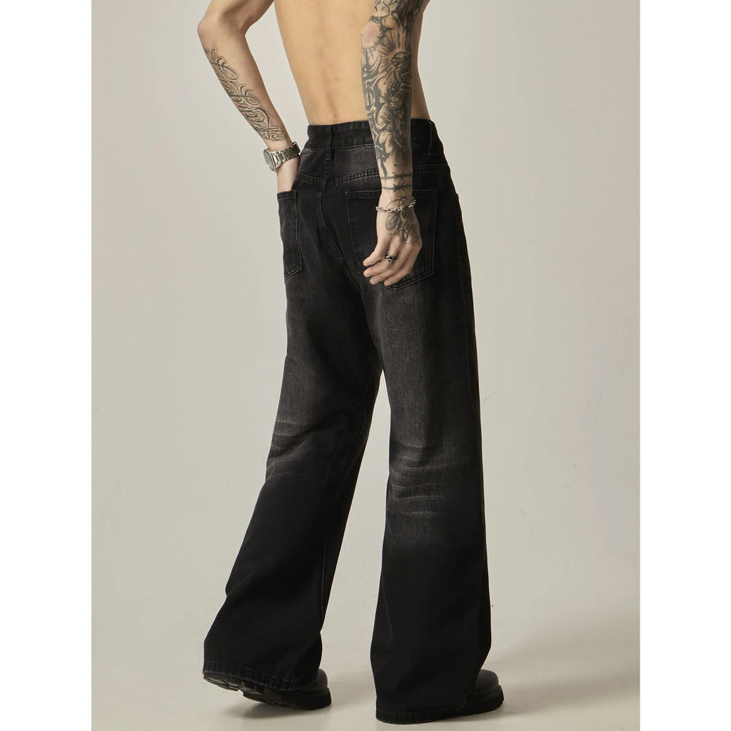 Black loose straight jeans with zipper fly on mannequin showing relaxed fit through leg