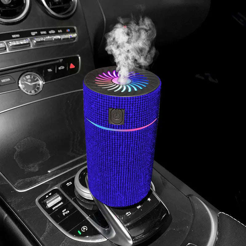 White diamond car humidifier measuring 14cm diameter on vehicle dashboard with USB cable connected