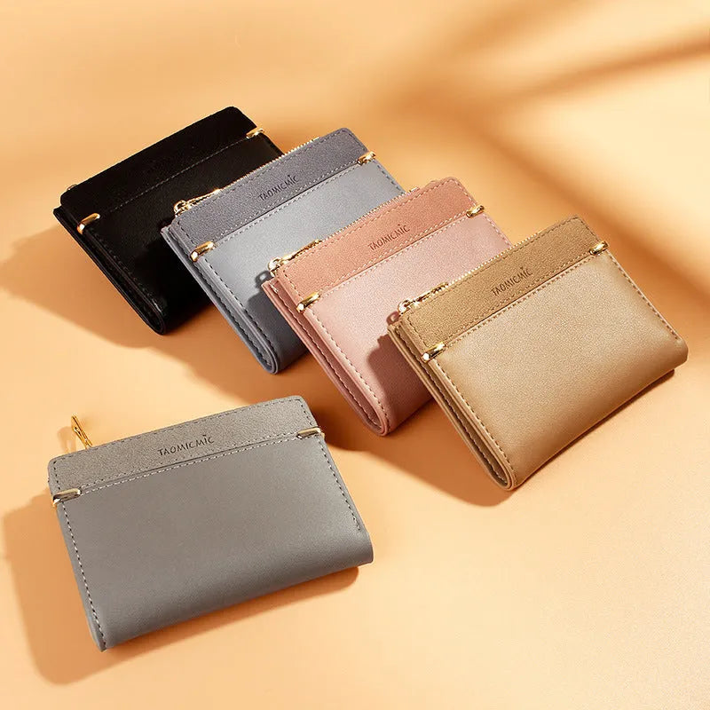 Black ladies wallet showing six internal compartments including photo slot, zipper section, card slots, and hidden compartment