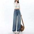 Women's retro blue wide-leg jeans with high waist and straight-leg design on hanger