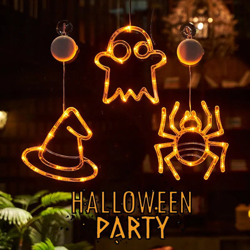 Halloween LED window lights set with spider, pumpkin and ghost designs on suction cups
