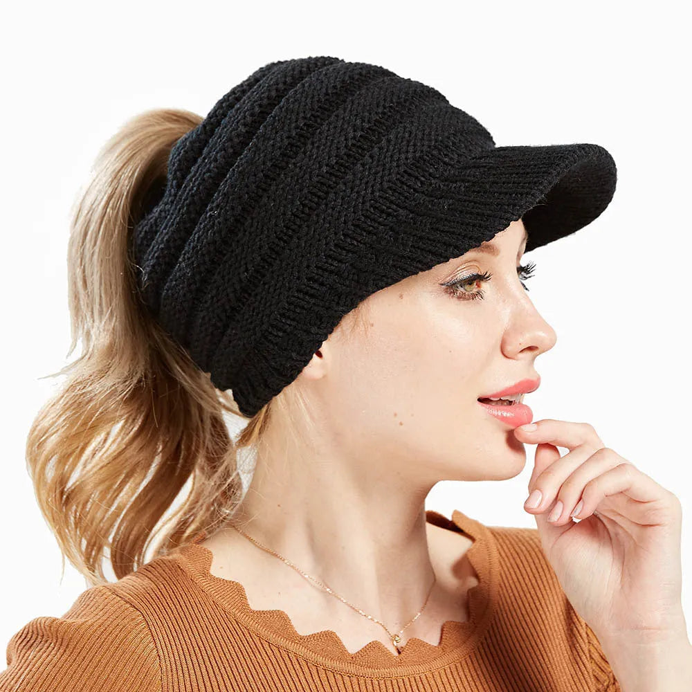Women's soft acrylic knit ponytail beanie hat in assorted colours on a white background