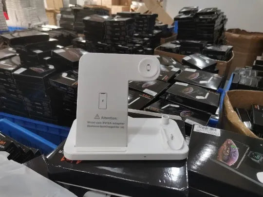 Folding 4-in-1 wireless charger in black, showing vertical stand and charging pads for Apple devices