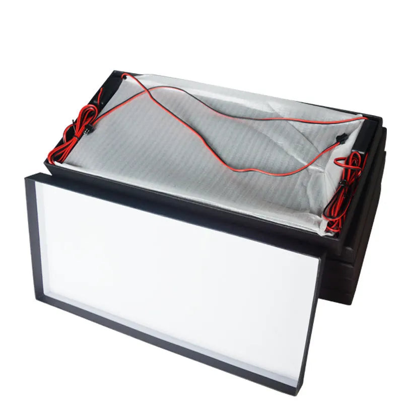 A pair of black plastic LED licence plate light bars for trucks on a white background.