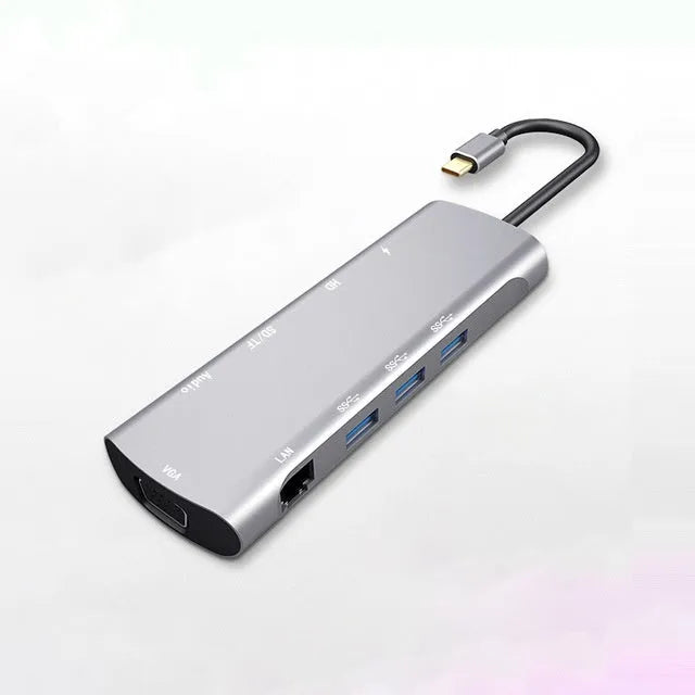 Grey USB-C docking station with HDMI, VGA, USB ports, and 140mm cable for laptop connectivity expansion