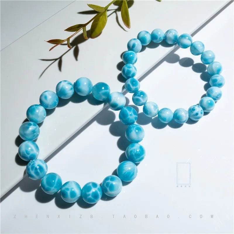 Blue Bodhi bead bracelet with manual processing and pearl accents in Maillard style, showing bead sizing options