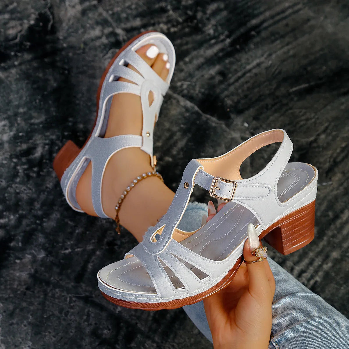 Women's black peep toe wedge platform sandals with an adjustable buckle strap on a white background.