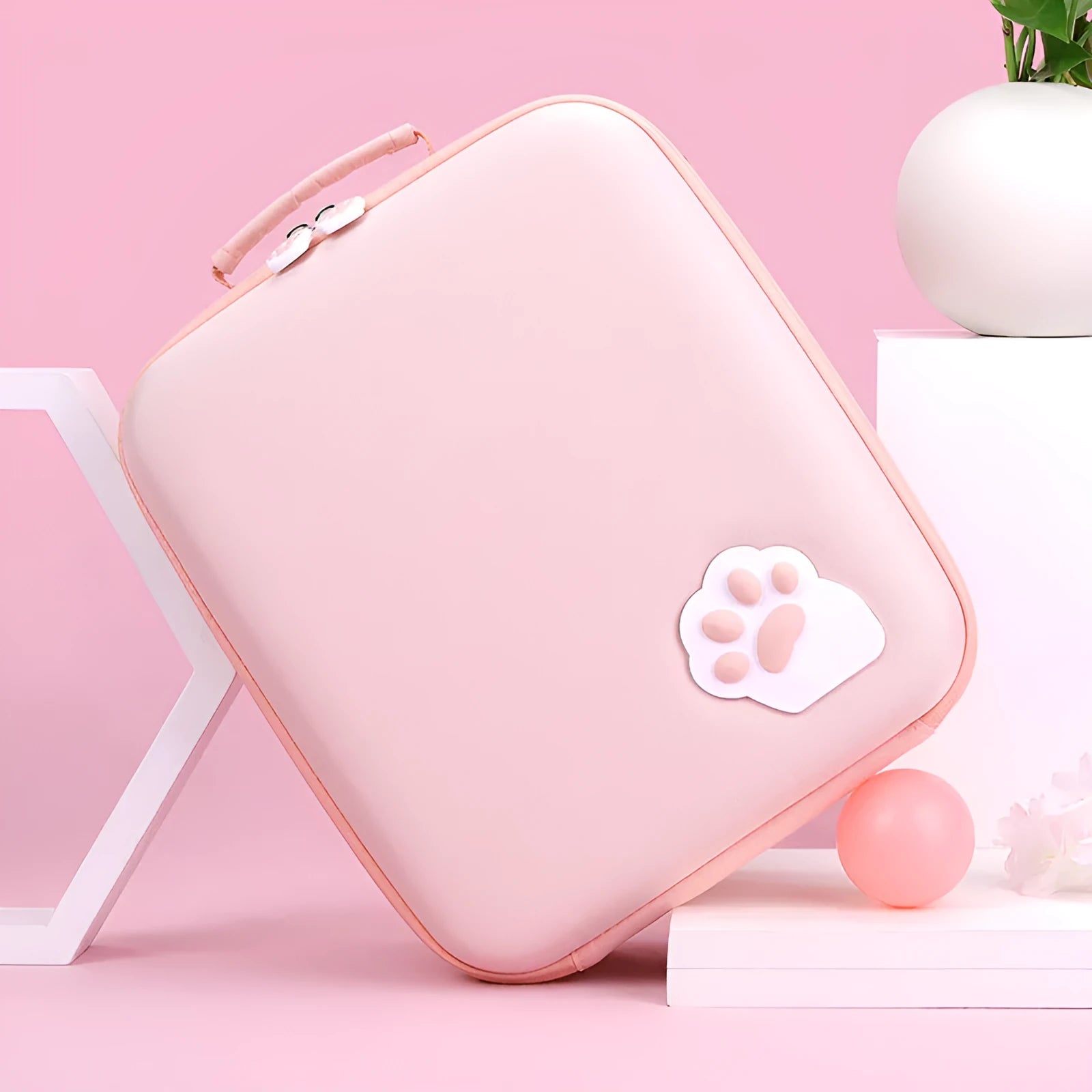 Pink Nintendo Switch storage bag with cat claw design, showing game cartridge slots and diagonal carry strap.