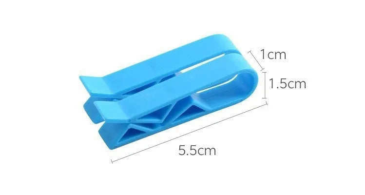 Black plastic non-slip clip for holding bin bags on the side of a trash can.