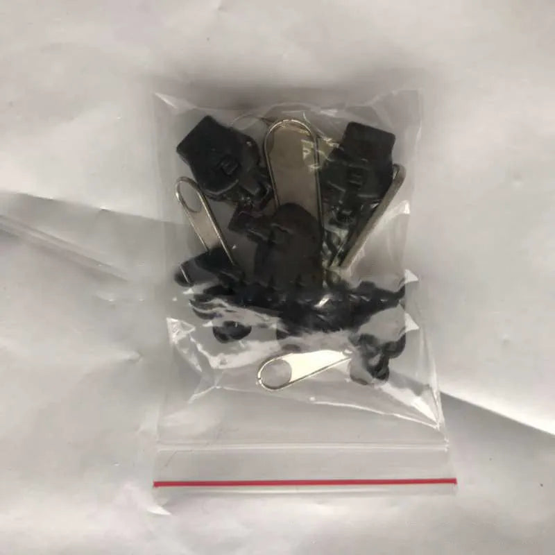 Pack of 12 snap-on zipper head replacements in plastic and metal for quick repair.