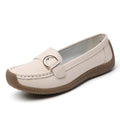 Women's beige casual loafers with round toe, flat heel, and shallow slip-on design.