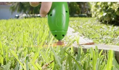 Cordless lawn trimmer with extension pole and protective debris shield for garden trimming tasks