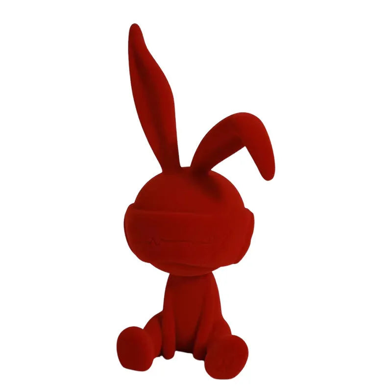 Green suede blindfold rabbit resin ornament on a wooden table, 15cm tall
