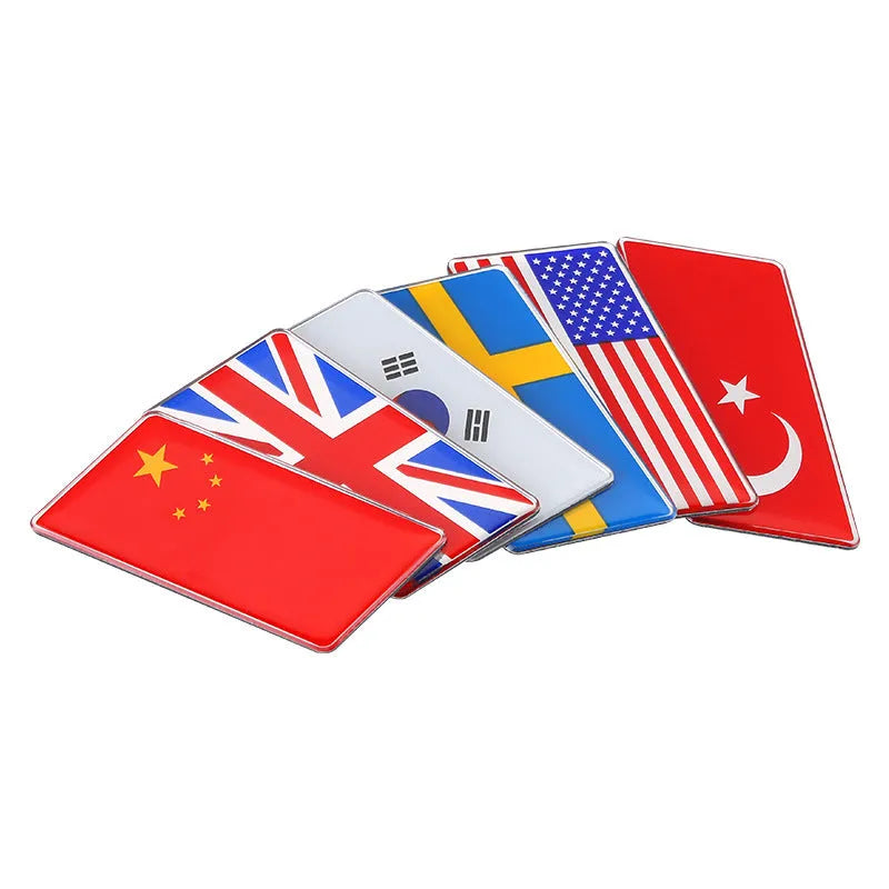 Aluminium national flag car sticker with metal crystal tail tag measuring 6.3cm by 3cm showing parallelogram shape